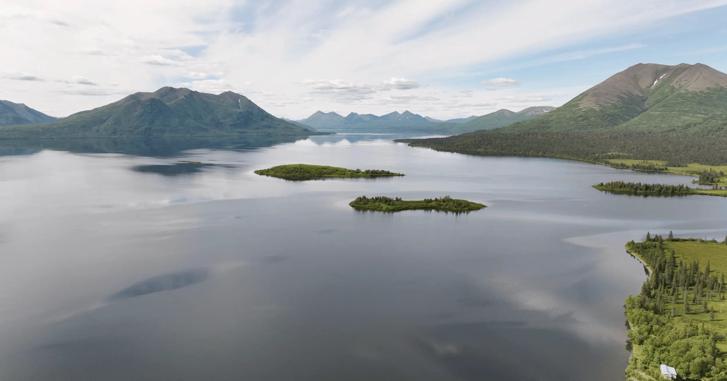 Choggiung Ltd. Lands drone shot over lake